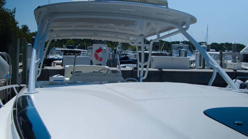 R&r Yacht Photos Pics 2017 Intrepid 400 Cuddy boat docked at a marina, showcasing its sleek design.