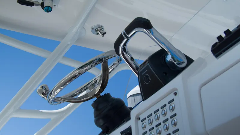 R&r Yacht Photos Pics Close-up of the helm and controls of a 2017 Intrepid 400 Cuddy boat.