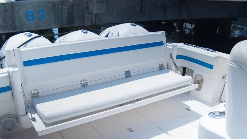 R&r Yacht Photos Pics 2017 Intrepid 400 Cuddy boat with fold-down seating and triple outboard engines.