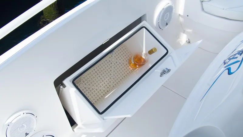 R&r Yacht Photos Pics Built-in cooler with a bottle of wine on a 2017 Intrepid 400 Cuddy boat.