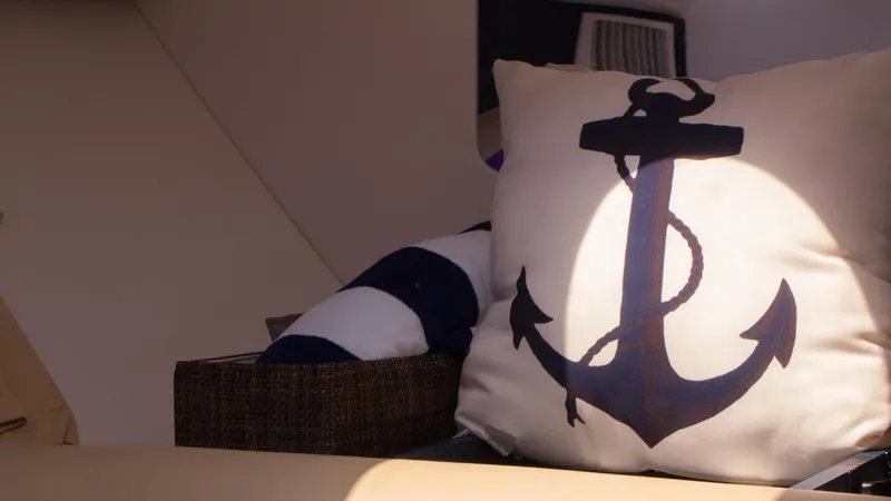 R&r Yacht Photos Pics Nautical-themed pillow with anchor design on 2017 Intrepid 400 Cuddy boat.