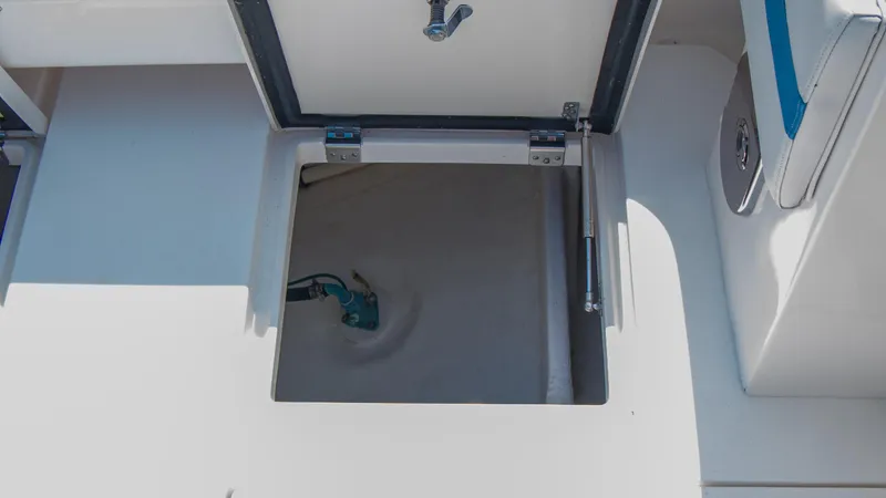 R&r Yacht Photos Pics Open storage compartment on a 2017 Intrepid 400 Cuddy boat.