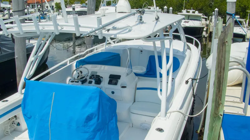 R&r Yacht Photos Pics 2017 Intrepid 400 Cuddy boat docked at a marina, featuring blue seat covers.