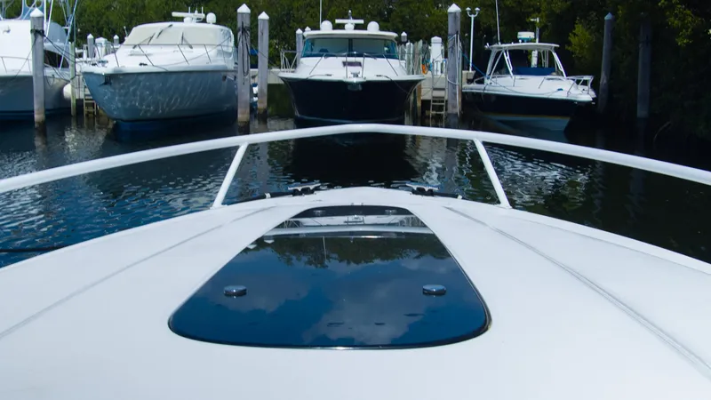 R&r Yacht Photos Pics View from the bow of a 2017 Intrepid 400 Cuddy boat docked at a marina.