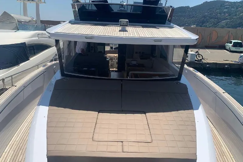 Pardo Endurance 60 Yacht Photos Pics 2023 Pardo Yachts E60 luxury yacht docked, featuring spacious deck and modern design.