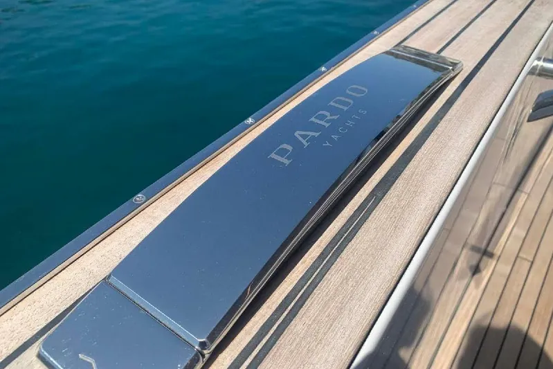 Pardo Endurance 60 Yacht Photos Pics 2023 Pardo Yachts E60 deck detail with logo, featuring sleek wood finish.