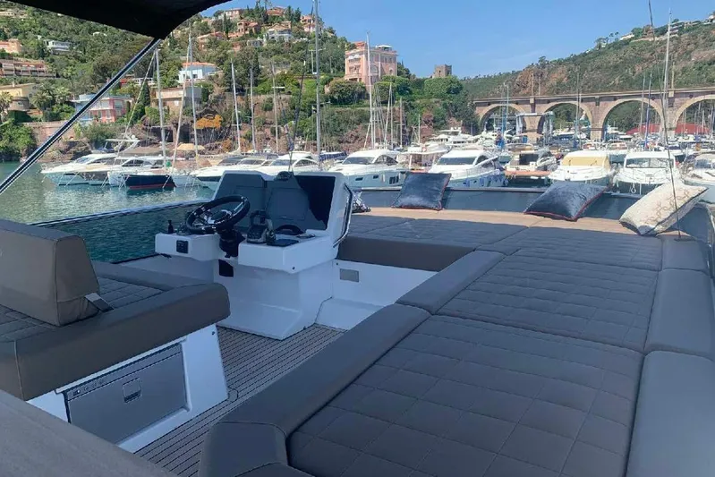 Pardo Endurance 60 Yacht Photos Pics Luxurious 2023 Pardo Yachts E60 with spacious deck, docked in scenic marina.