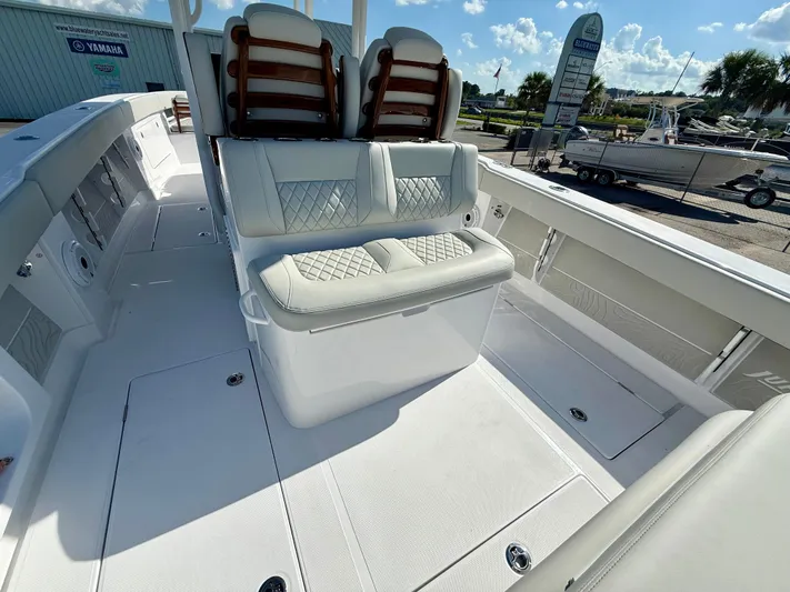  Yacht Photos Pics 2026 Jupiter 34 boat interior with cushioned seating and sleek design.