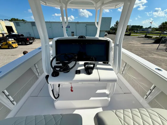  Yacht Photos Pics Center console of a 2026 Jupiter 34 boat with steering wheel and controls.