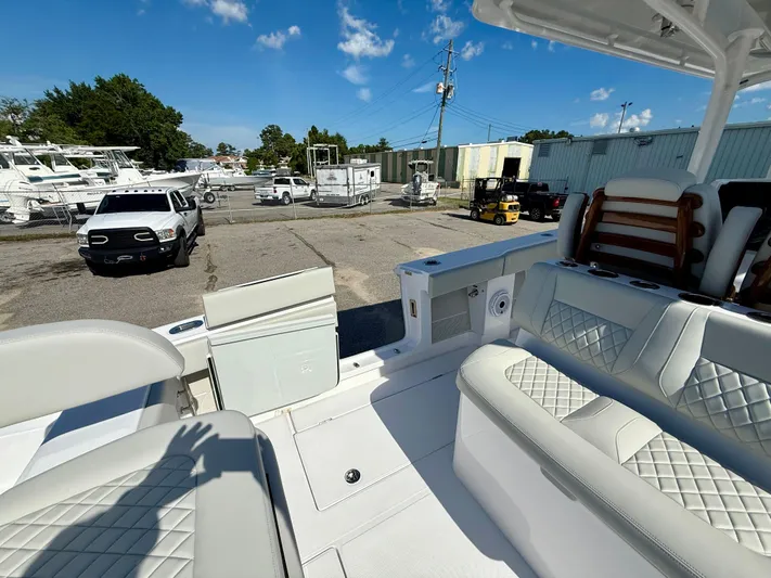  Yacht Photos Pics Interior view of a 2026 Jupiter 34 boat with luxurious seating and outdoor setting.