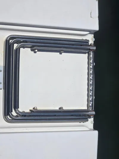 Michael B Yacht Photos Pics Folded metal ladder on a 1998 Sea Ray 500 Sundancer boat.