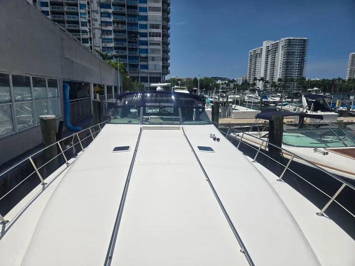 Michael B Yacht Photos Pics 1998 Sea Ray 500 Sundancer yacht docked at marina with cityscape background.