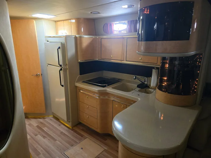 Michael B Yacht Photos Pics Interior of 1998 Sea Ray 500 Sundancer yacht with modern kitchen amenities.
