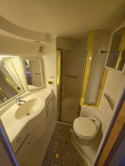 Michael B Yacht Photos Pics Bathroom interior of 1998 Sea Ray 500 Sundancer yacht with shower, sink, and toilet.