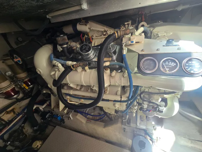 Michael B Yacht Photos Pics Engine room of a 1998 Sea Ray 500 Sundancer boat, showcasing mechanical components.