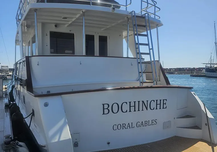 Bochinche Yacht Photos Pics 2006 Grand Alaskan 65 Flush Deck yacht docked, featuring "Bochinche" and "Coral Gables" on the stern.