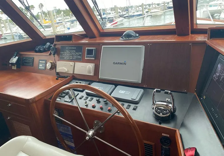 Bochinche Yacht Photos Pics Helm of 2006 Grand Alaskan 65 Flush Deck yacht with navigation equipment.