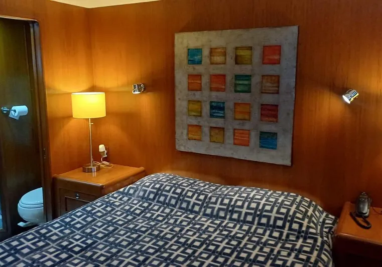 Bochinche Yacht Photos Pics Cozy bedroom in 2006 Grand Alaskan 65 Flush Deck yacht with modern decor.