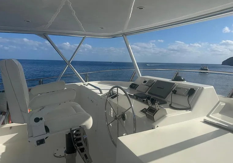 Bochinche Yacht Photos Pics Helm of 2006 Grand Alaskan 65 Flush Deck yacht with ocean view.