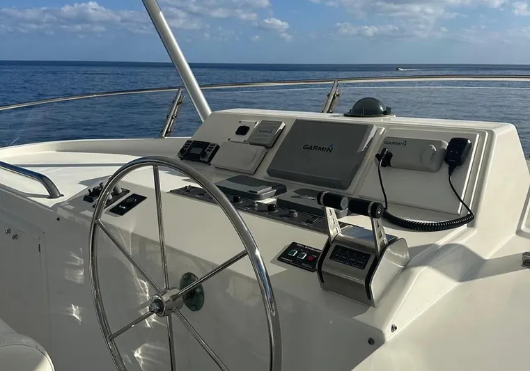 Bochinche Yacht Photos Pics Helm of 2006 Grand Alaskan 65 Flush Deck yacht with Garmin navigation system.