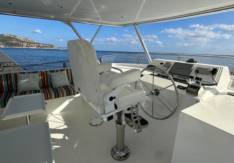 Bochinche Yacht Photos Pics Helm of 2006 Grand Alaskan 65 Flush Deck yacht with ocean view.