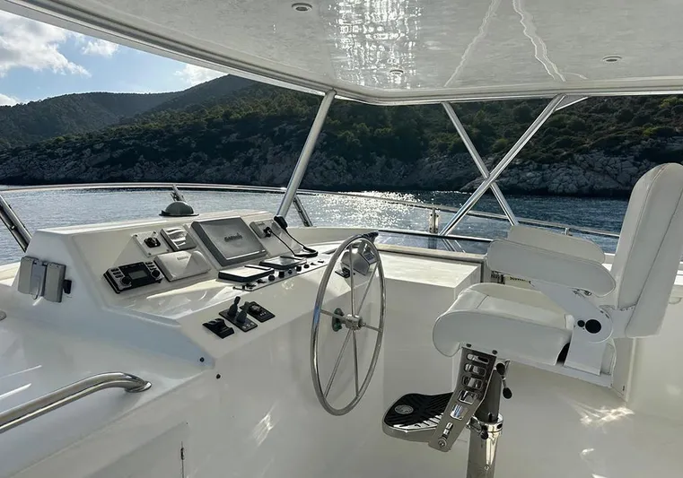 Bochinche Yacht Photos Pics Helm of 2006 Grand Alaskan 65 Flush Deck yacht with scenic ocean view.