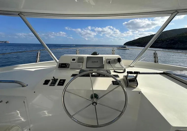 Bochinche Yacht Photos Pics Helm of 2006 Grand Alaskan 65 Flush Deck yacht with ocean view.