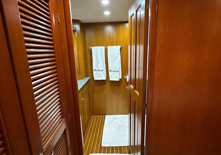 Bochinche Yacht Photos Pics Luxurious wooden interior of 2006 Grand Alaskan 65 Flush Deck yacht bathroom.