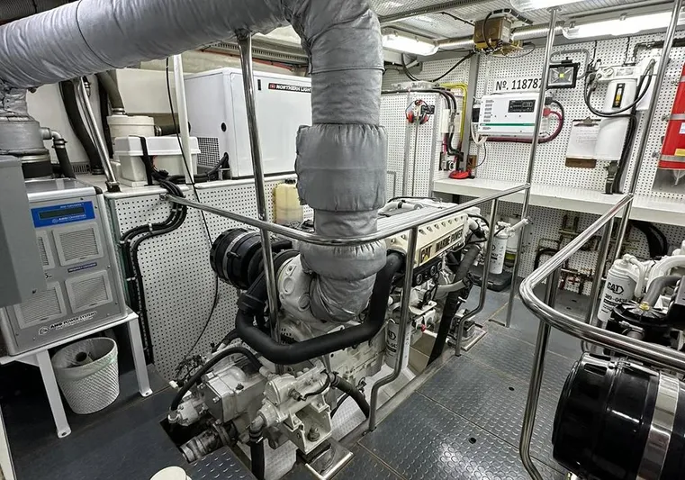 Bochinche Yacht Photos Pics Engine room of 2006 Grand Alaskan 65 Flush Deck yacht, featuring CAT marine power engine.