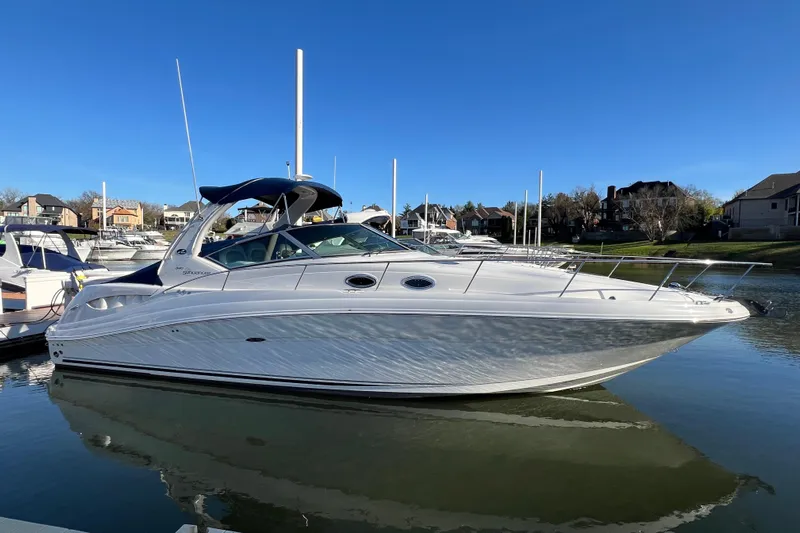 Mile Marker Yacht Photos Pics 2008 Sea Ray 340 Sundancer yacht docked in a marina under clear blue skies.