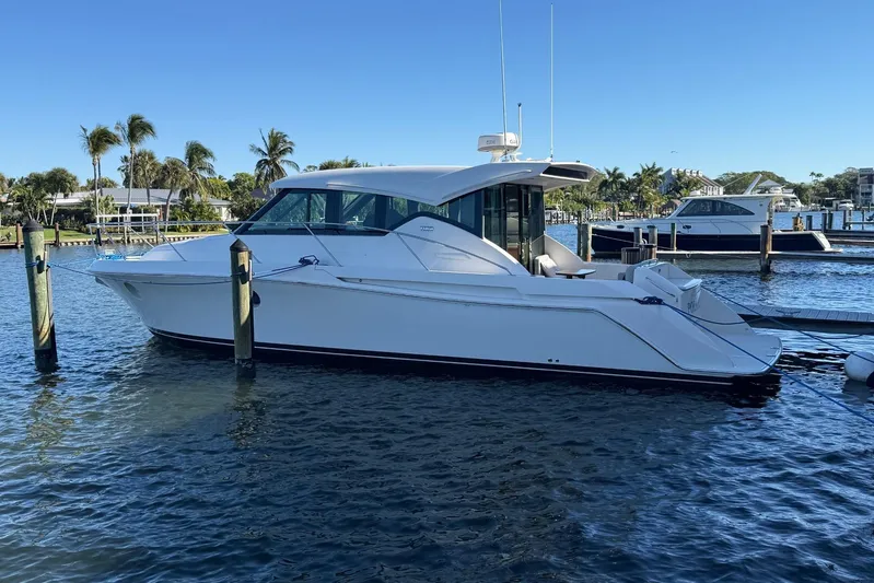 Polaris Yacht Photos Pics 2018 Tiara Yachts C39 Coupe docked in a sunny marina setting.