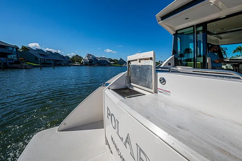 Polaris Yacht Photos Pics 2018 Tiara Yachts C39 Coupe on serene waterfront, showcasing luxury and style.