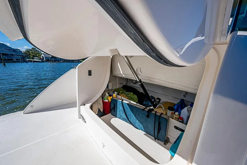 Polaris Yacht Photos Pics Storage compartment on 2018 Tiara Yachts C39 Coupe, open with various items inside.