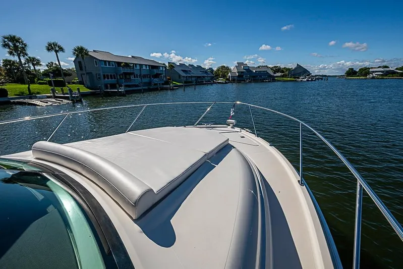 Polaris Yacht Photos Pics 2018 Tiara Yachts C39 Coupe on serene waterway with scenic waterfront homes.