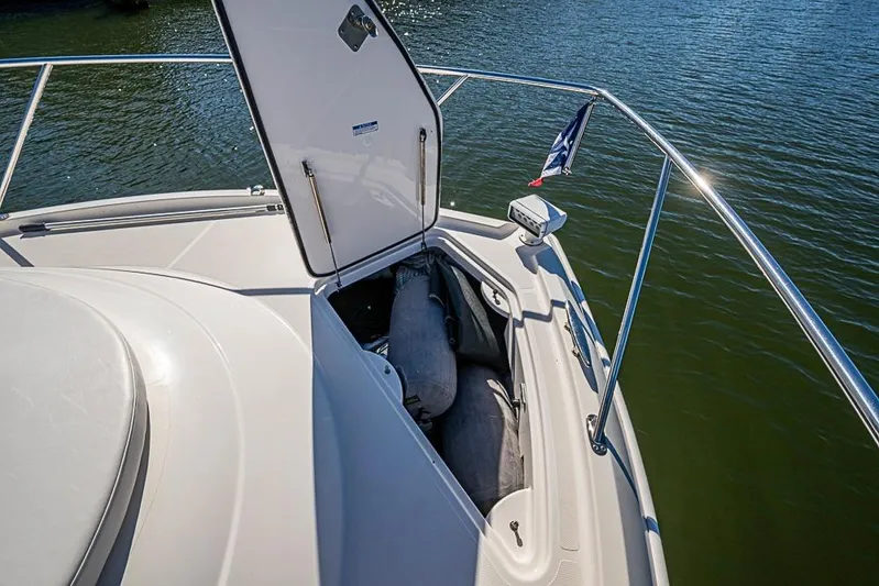 Polaris Yacht Photos Pics 2018 Tiara Yachts C39 Coupe bow storage compartment open on calm water.