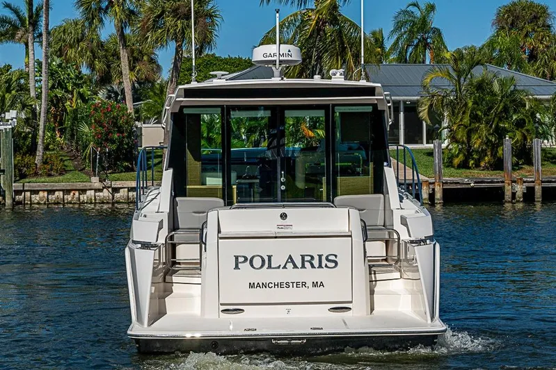 Polaris Yacht Photos Pics 2018 Tiara Yachts C39 Coupe on water, rear view, tropical setting.