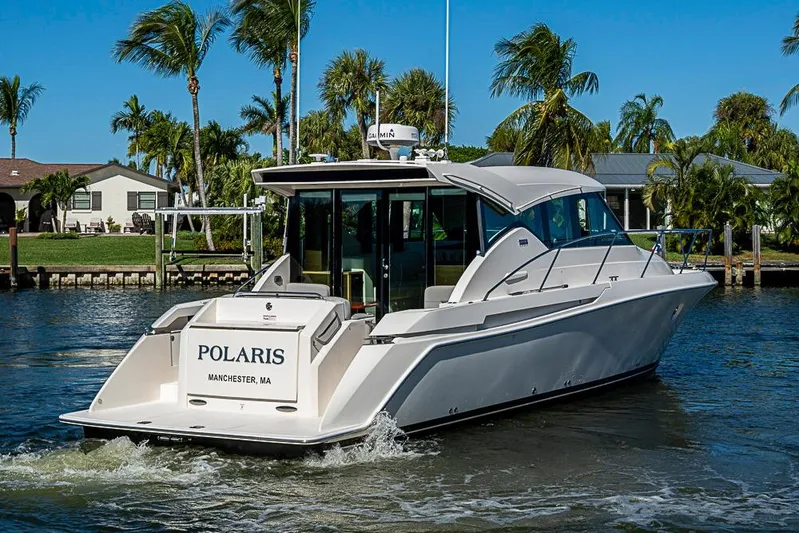 Polaris Yacht Photos Pics 2018 Tiara Yachts C39 Coupe cruising in a tropical waterfront setting.