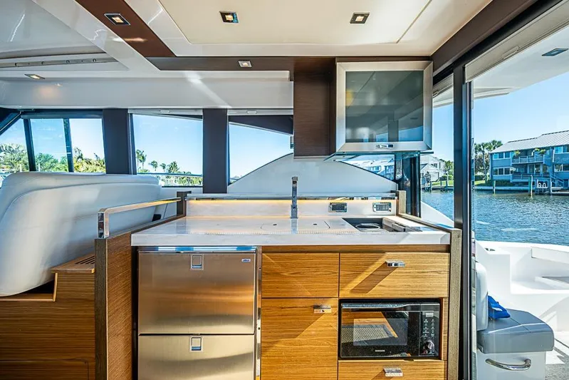 Polaris Yacht Photos Pics Interior of 2018 Tiara Yachts C39 Coupe, featuring modern kitchen with water view.