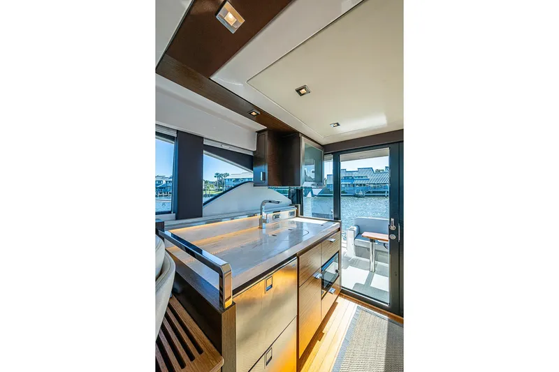 Polaris Yacht Photos Pics Interior of 2018 Tiara Yachts C39 Coupe, featuring modern kitchen and outdoor view.