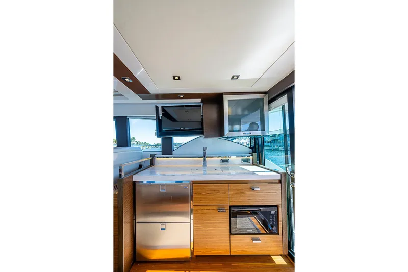 Polaris Yacht Photos Pics Luxurious 2018 Tiara Yachts C39 Coupe kitchen interior with modern appliances and sleek design.