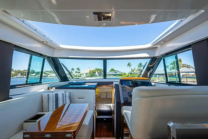 Polaris Yacht Photos Pics Interior of 2018 Tiara Yachts C39 Coupe with panoramic windows and luxurious seating.