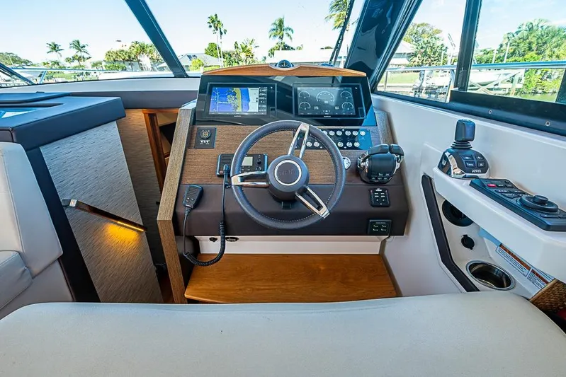 Polaris Yacht Photos Pics Helm of 2018 Tiara Yachts C39 Coupe with modern navigation controls and steering wheel.
