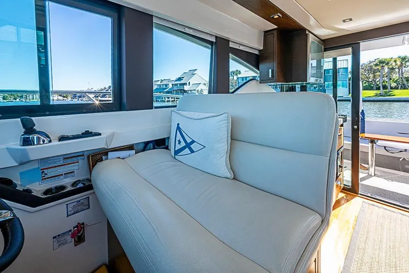 Polaris Yacht Photos Pics Interior of 2018 Tiara Yachts C39 Coupe with plush seating and scenic window view.