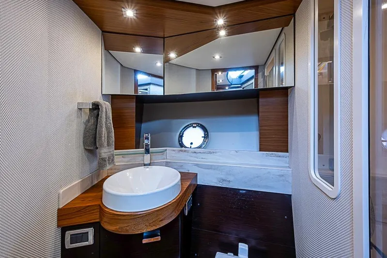 Polaris Yacht Photos Pics Luxurious bathroom interior of 2018 Tiara Yachts C39 Coupe with modern fixtures and elegant design.