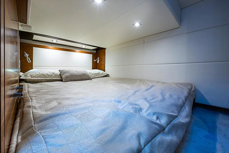 Polaris Yacht Photos Pics Luxurious bedroom interior of 2018 Tiara Yachts C39 Coupe with modern lighting and cozy bedding.