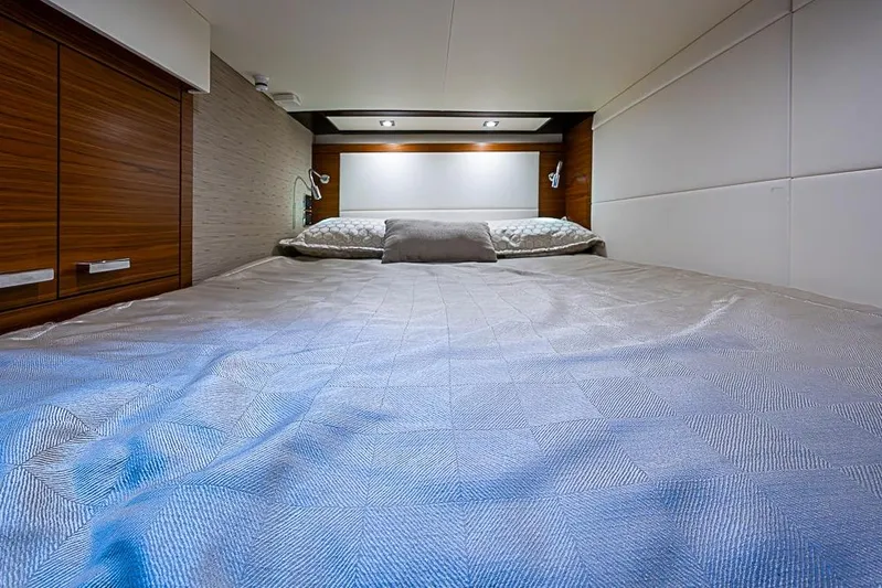 Polaris Yacht Photos Pics Luxurious bedroom interior of 2018 Tiara Yachts C39 Coupe with elegant bedding.