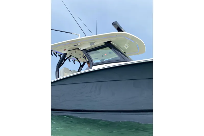  Yacht Photos Pics 2020 Scout 355 LXF boat on water, showcasing sleek design and modern features.