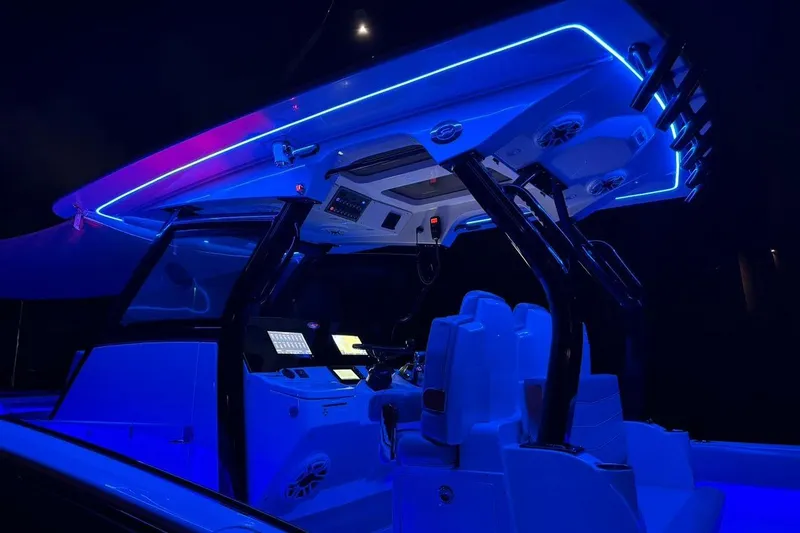  Yacht Photos Pics 2020 Scout 355 LXF boat interior with blue LED lighting at night.