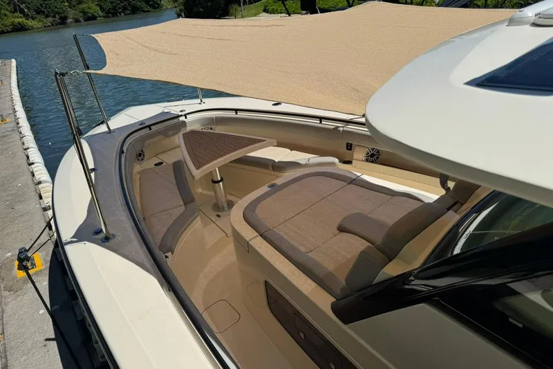  Yacht Photos Pics 2020 Scout 355 LXF boat with shaded seating area and elegant design.