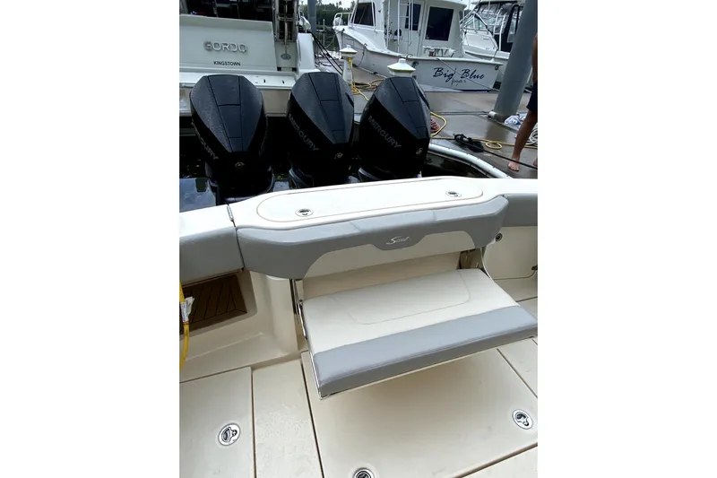  Yacht Photos Pics 2020 Scout 355 LXF boat with Mercury engines at a marina dock.